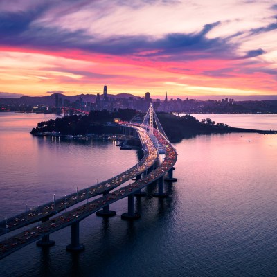 Aerial view of San Francisco Oakland Bay Bridge and Treasure Island at Sunset, California, USA