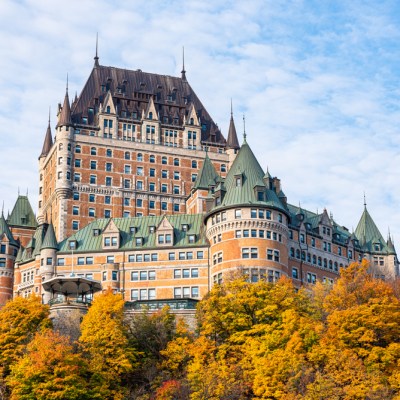 Frontenac Castle aka Fairmont Le Château Frontenac in old Quebec with fall foliage in foreground