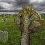 Old Celtic gravesite with unmarked gravestones from the 1600's in the middle of a meadow in rural Scotland.