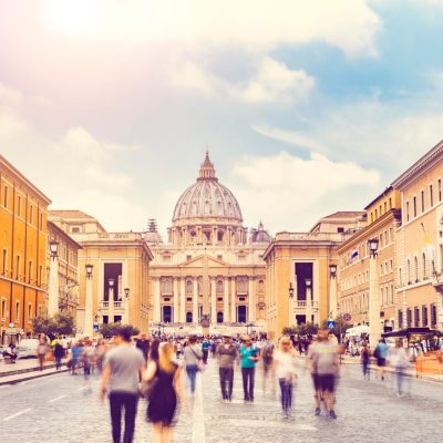 people walking in St. Peter's square (Basilica) in Vatican City, Rome, Italy