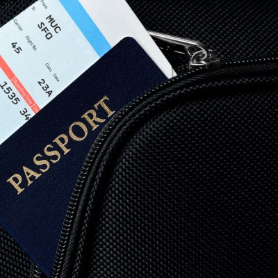 passport and boarding pass in a suitcase