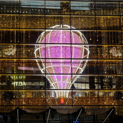 Manhattan's Hudson Yards complex and its landmark Vessel are illuminated with festive light displays.
