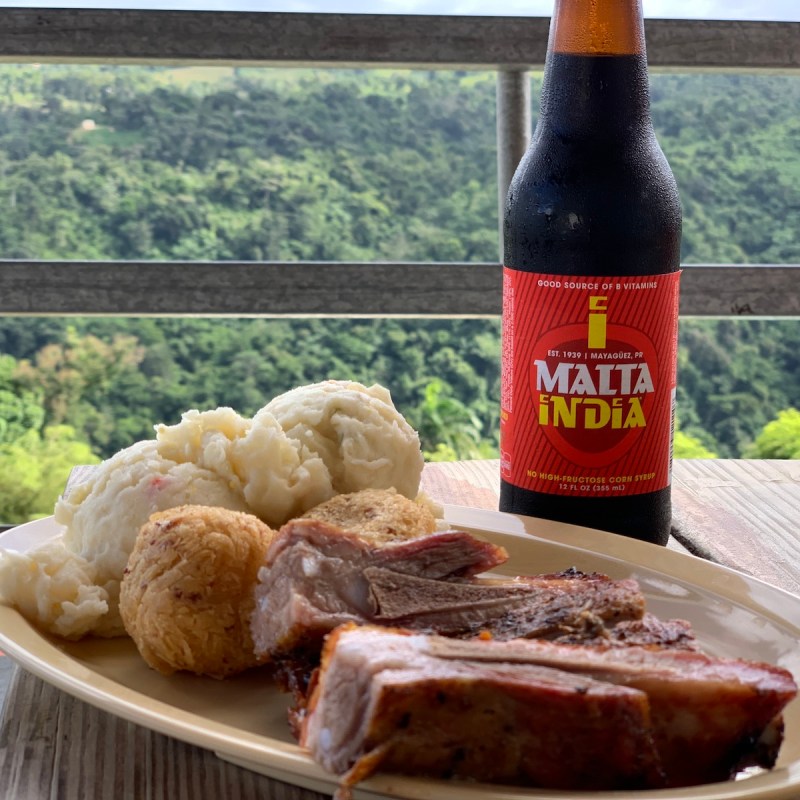 Meal with Malta drink along Puerto Rico's Pork Highway.
