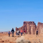 The author's daughter and grandchild walking in Arches National Park.