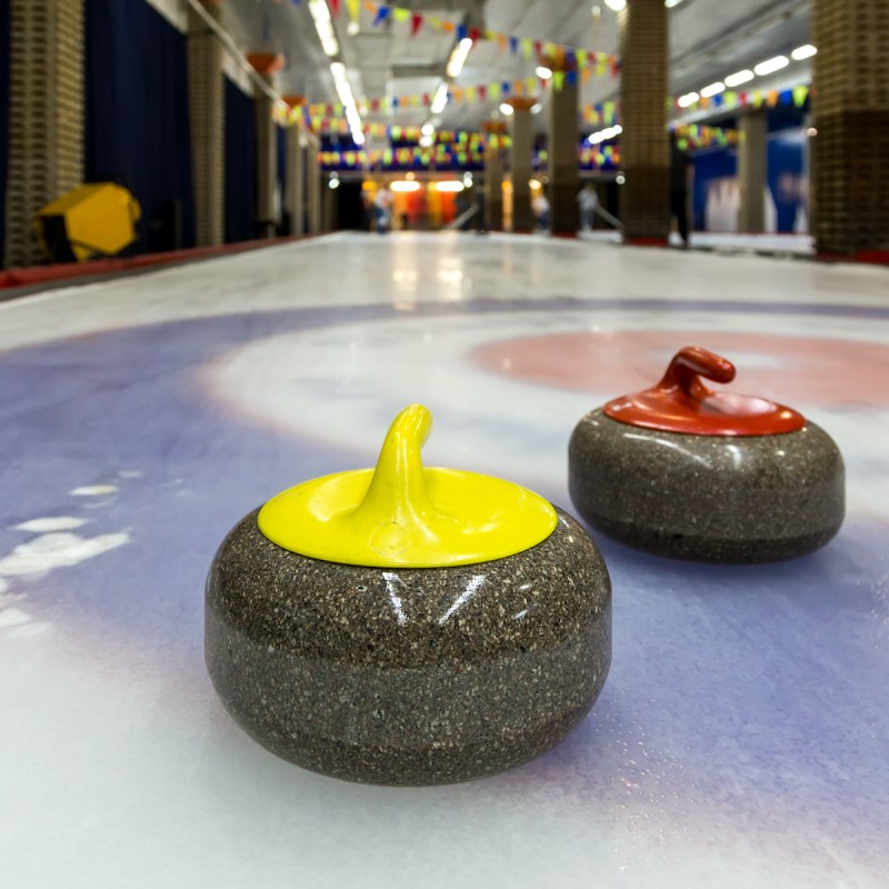 Curling stones at an indoor rink