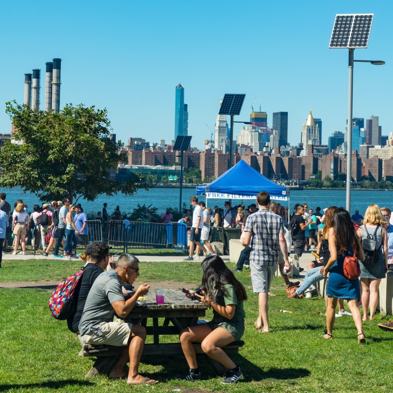 People enjoying the Smorgasburg market in Brooklyn