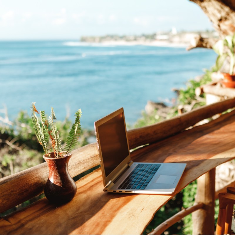 Remote work on a waterfront balcony.