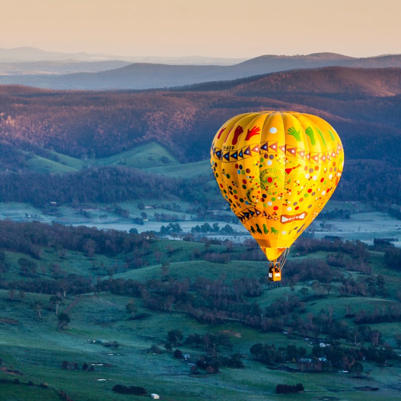 A sunrise hot air balloon flight over the Yarra Valley in Victoria, Australia