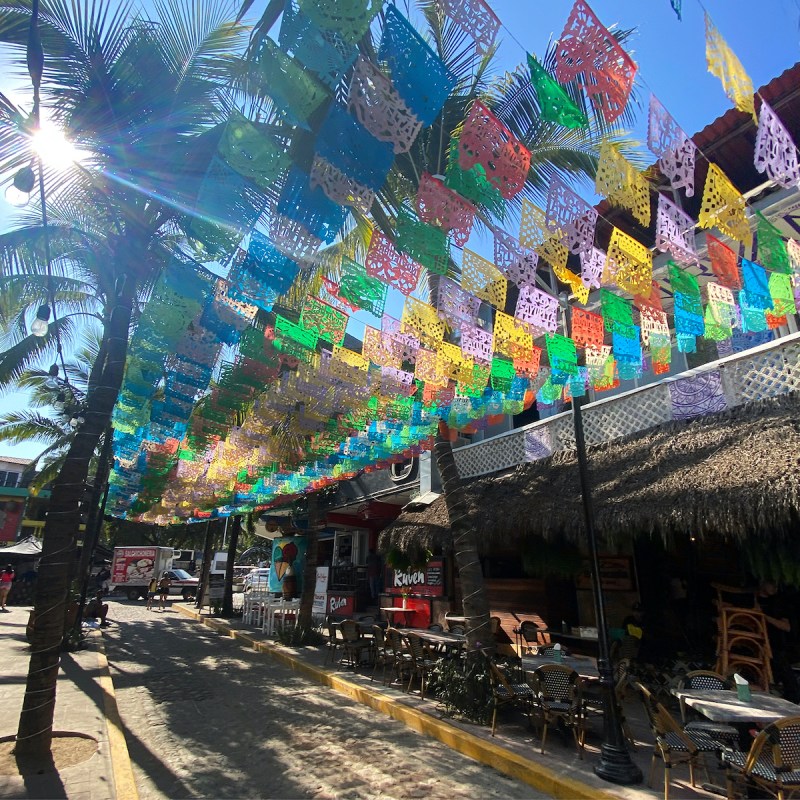 Flags fly overhead in downtown Sayulita.