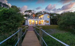 white vacation home in St. Augustine with wooden walkway