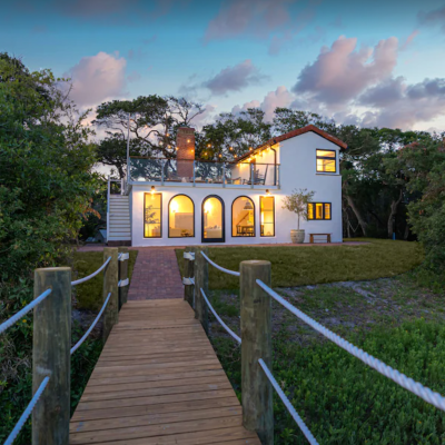white vacation home in St. Augustine with wooden walkway