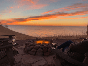 couple drinking wine at vacation home overlooking Lake Michigan