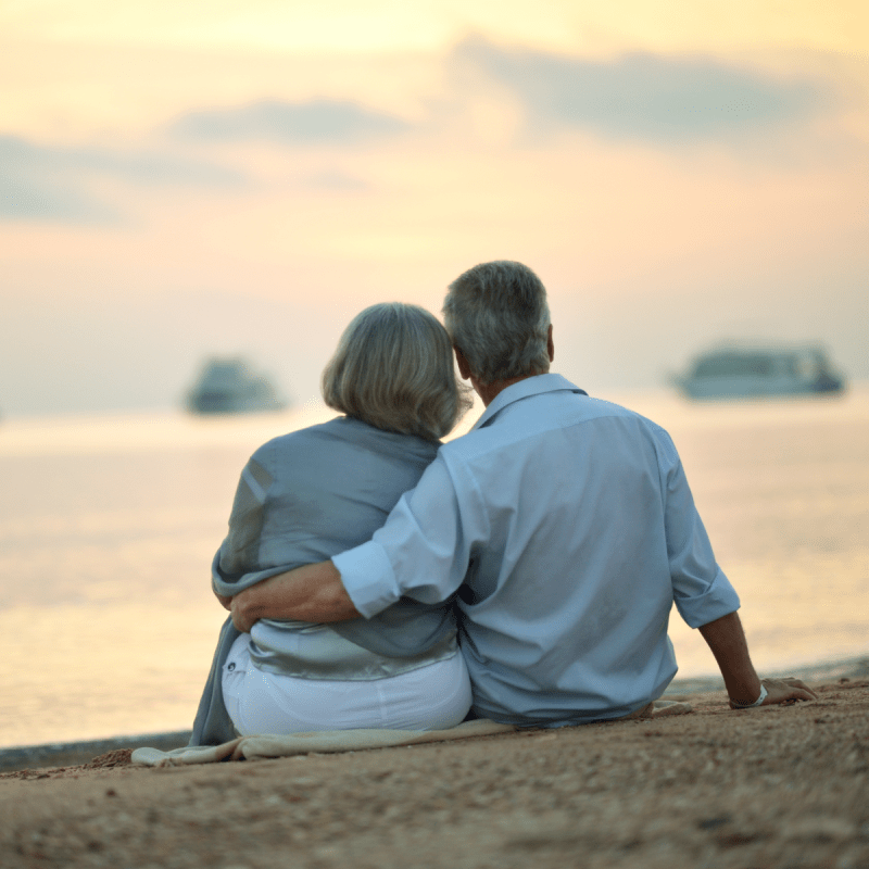 Couple looks out at a body of water.