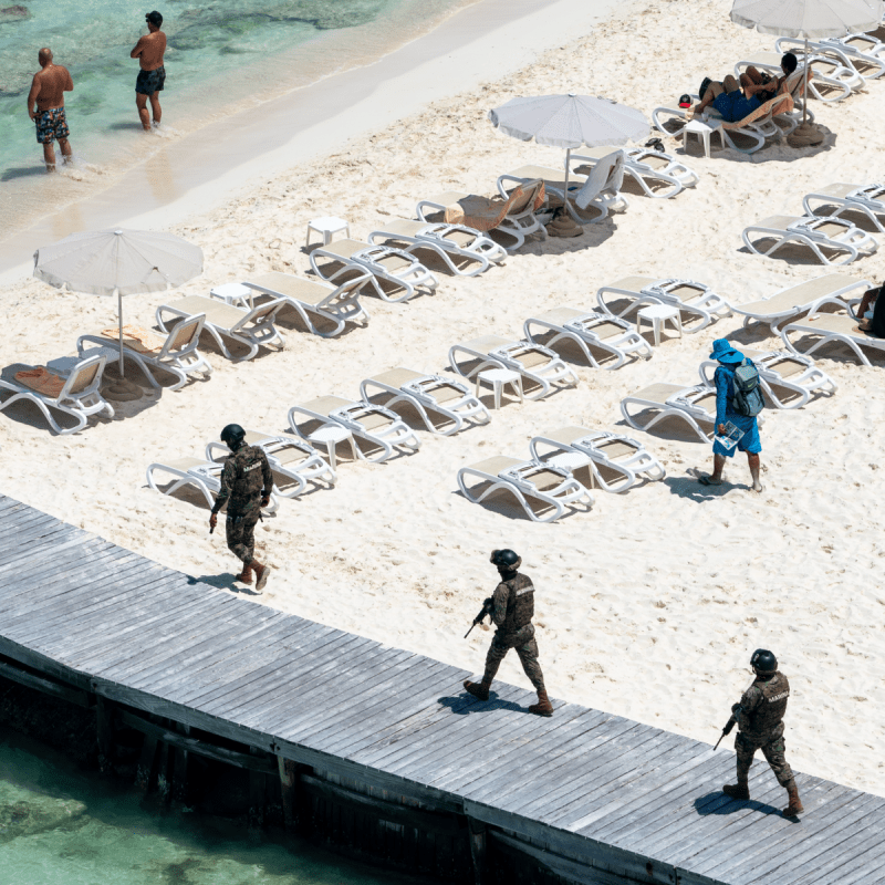 Marina soldiers of Mexican army patrolling beach in Cancun.