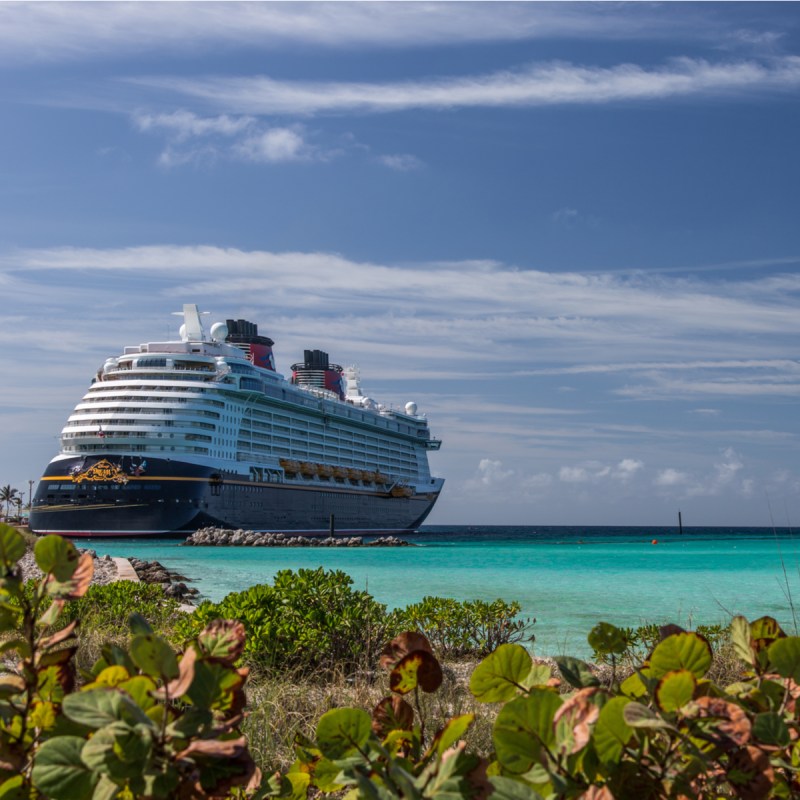 Anchored Disney Cruise Line ship called Dream picture taken from its far back on Castaway Cay, Bahamas.