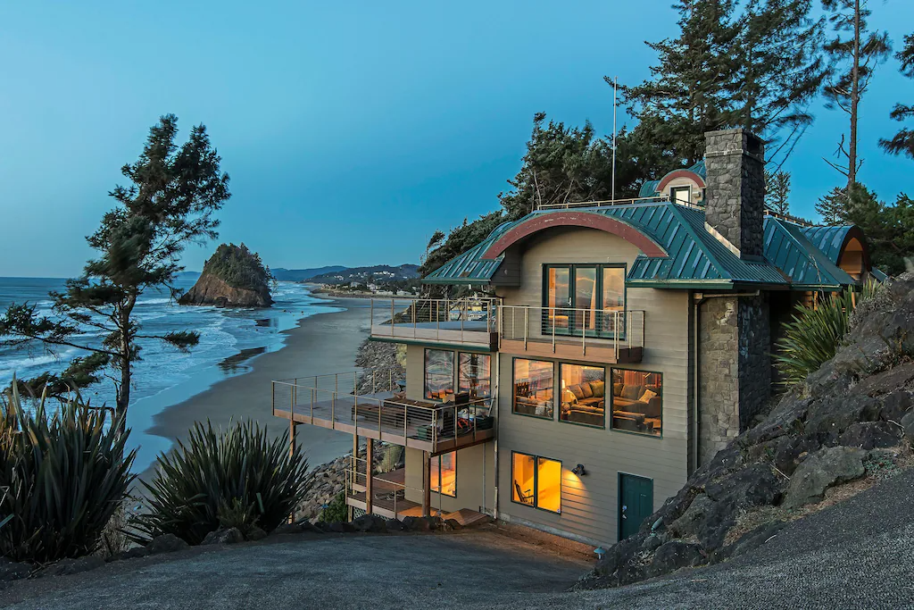 beautiful oceanfront vacation rental in Neskowin, Oregon lit up at dusk
