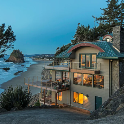 beautiful oceanfront vacation rental in Neskowin, Oregon lit up at dusk