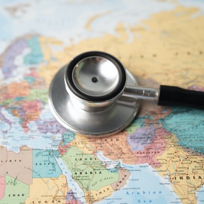 Stethoscope over world map