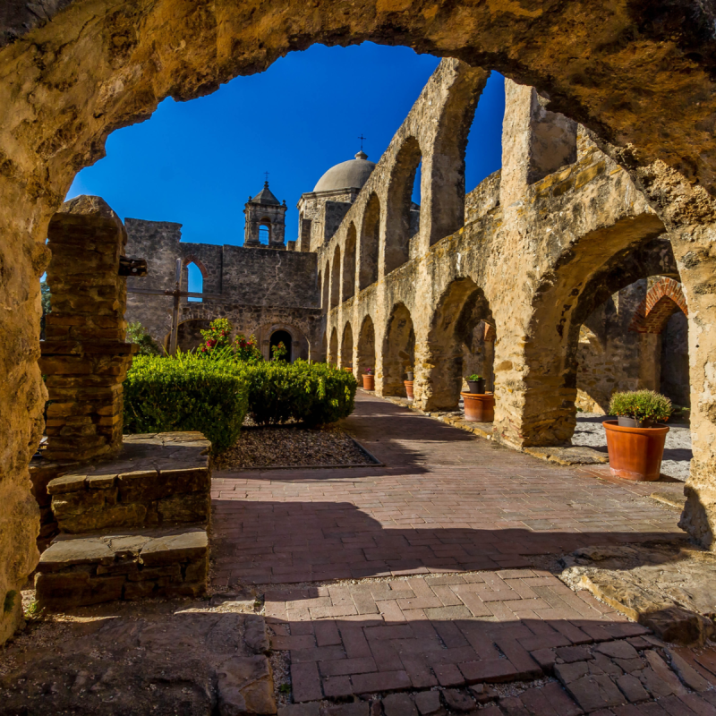 Interesting View Through an Old Stone Arch of the Historic Old West Spanish Mission San Jose.