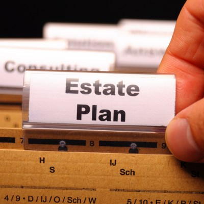 real estate plan on business folder showing buy a house concept
