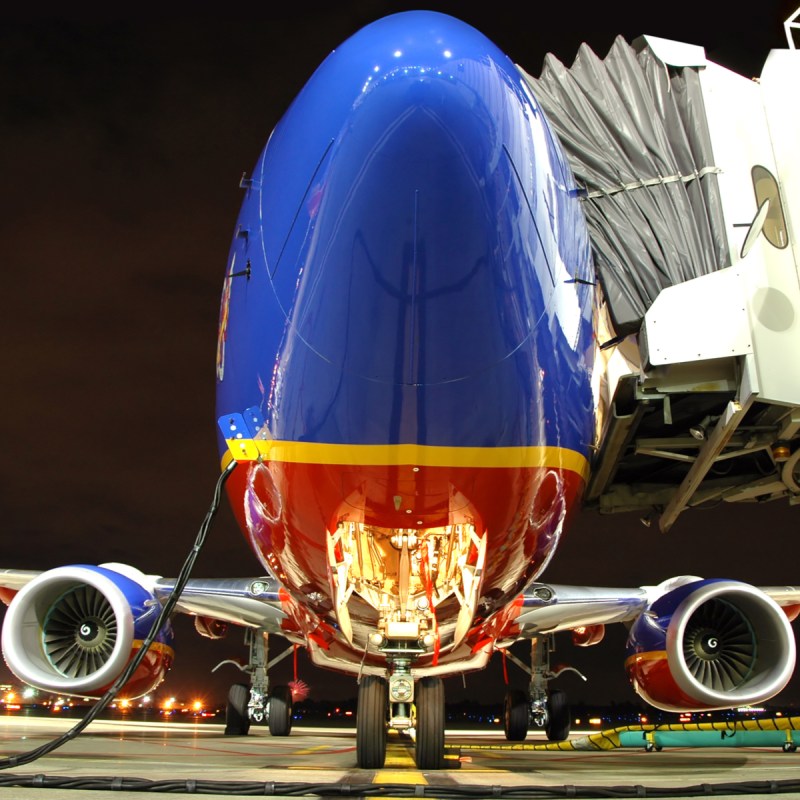Southwest Airlines plane at the gate at night.