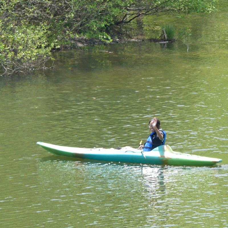 Member of Kathleen's group in a paddleboat on Lake Laurel