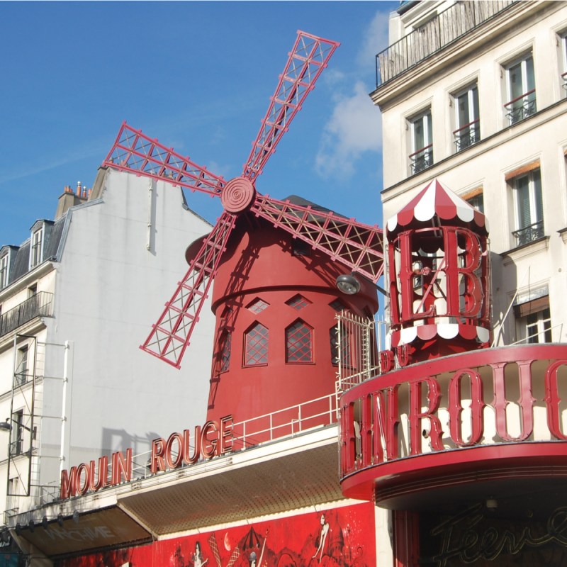 Windmill atop the Moulin Rouge in Paris, France.