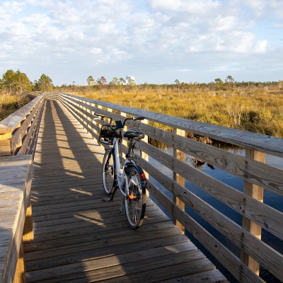 A bike on the boardwalk at Gulf State Park