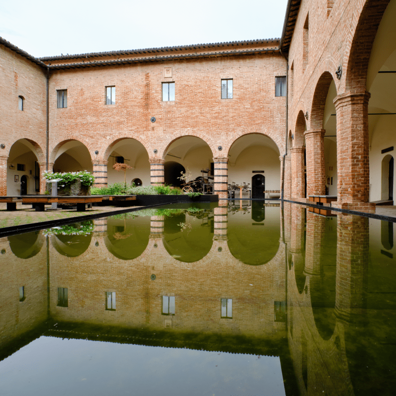Courtyard and arcade at the Paper and Watermark Museum in Fabriano, Italy.