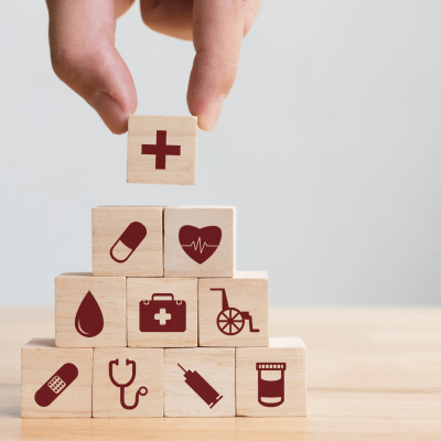 Hand arranging wood block stacking with icon healthcare medical, Insurance for your health