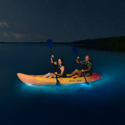 couple kayaking in a Bioluminescent Bay in Puerto Rico at night