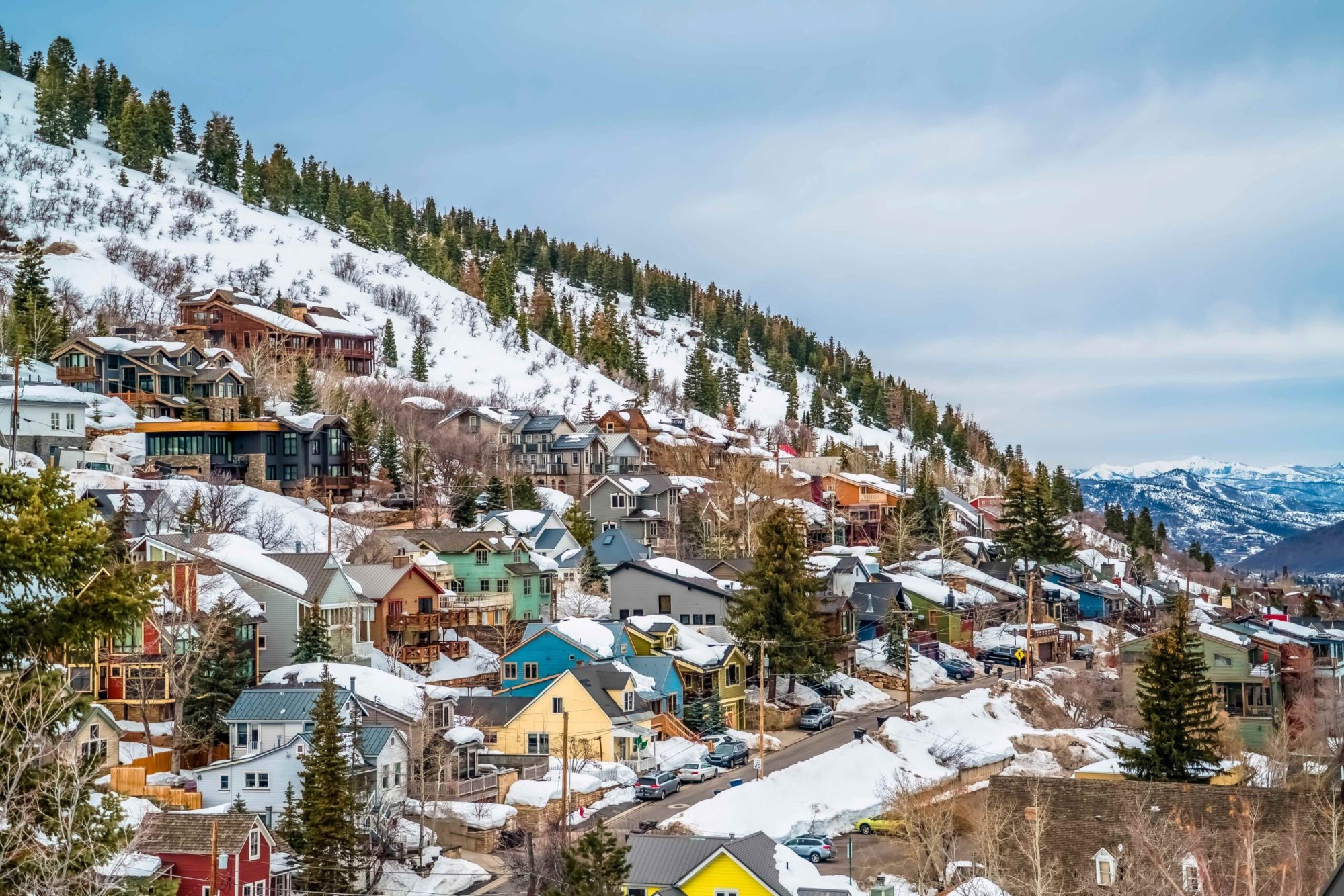 Cabins on mountains in Park City, Utah during winter ski season