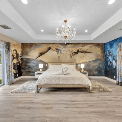 creation painting above bed