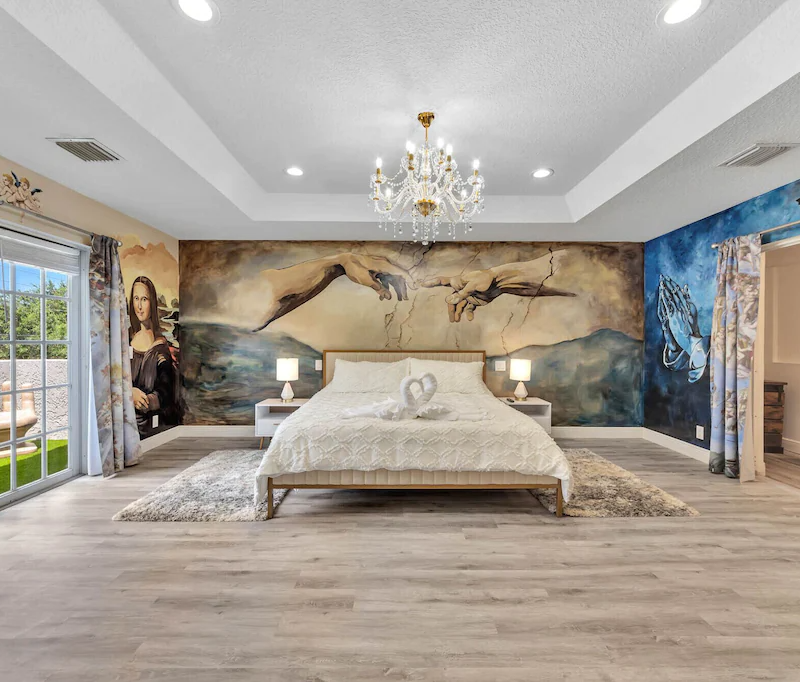 creation painting above bed