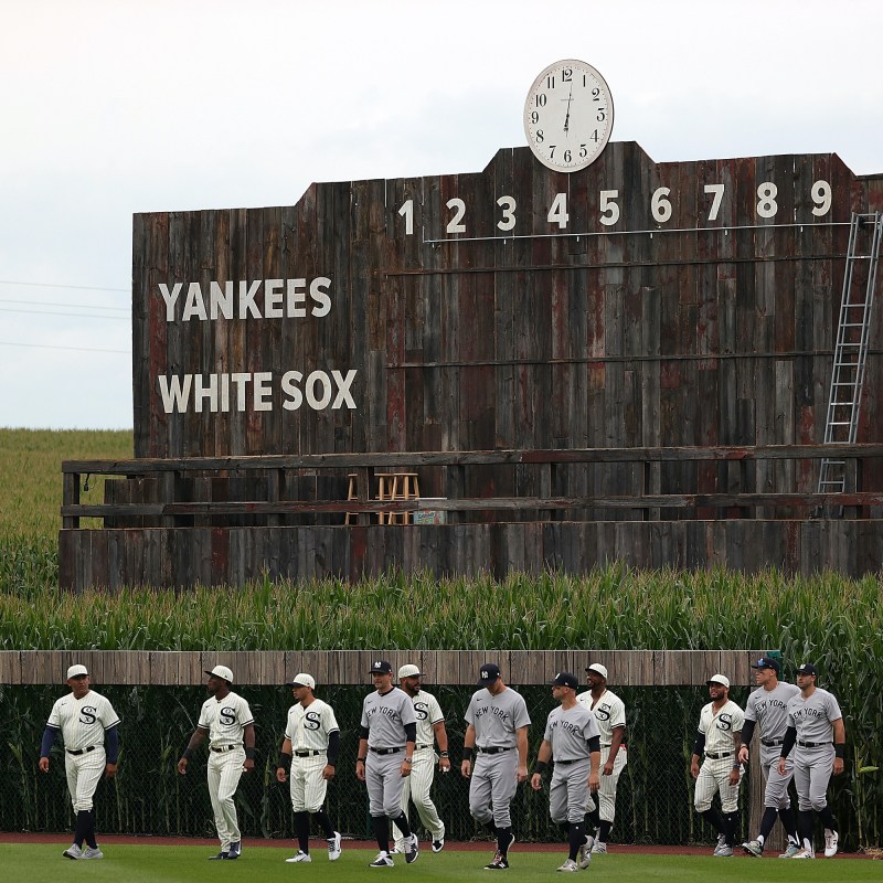 Chicago White Sox and New York Yankees players enter through the corn at the August 12, 2021, Field of Dreams Game.