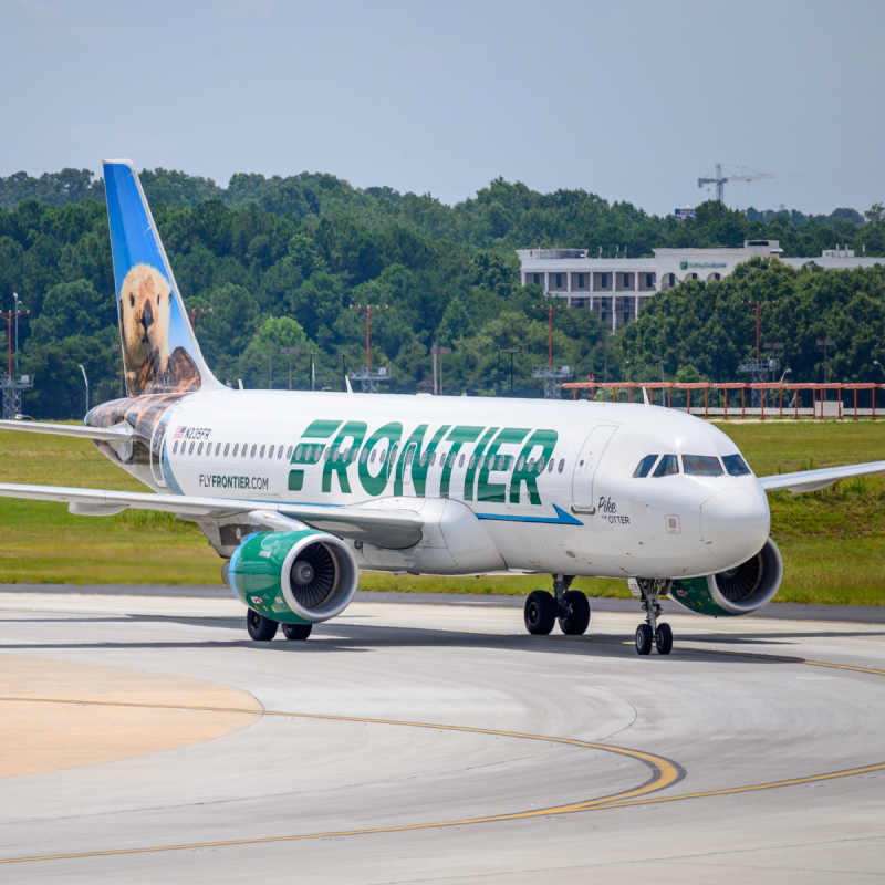 Frontier Airlines jet with an otter on the tail.