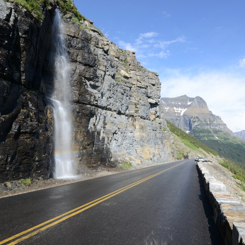 waterfall along the going to the sun road in glacier national park in montana