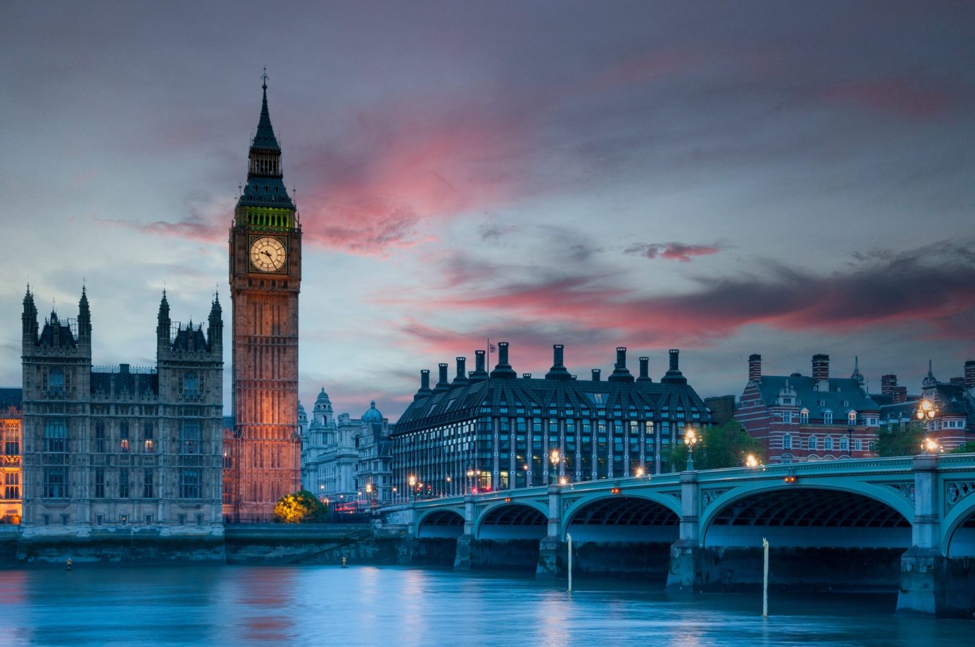 Big Ben and Westminster Bridge at sunset in London, England