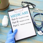 Stethoscope with medicare form with parts list in hand