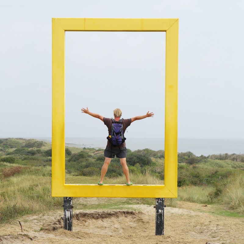 standing in National Geographic yellow window