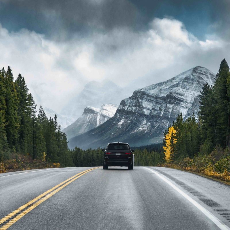 Car on road trip to Banff National Park