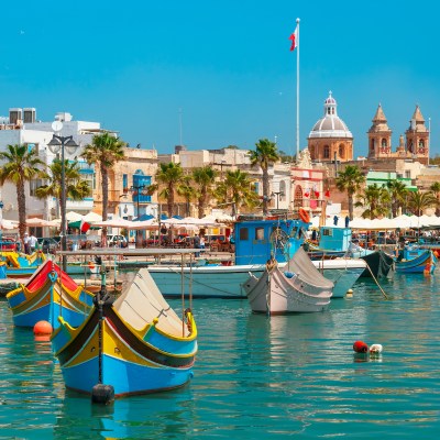 Luzzus in the the harbor of Marsaxlokk, Malta