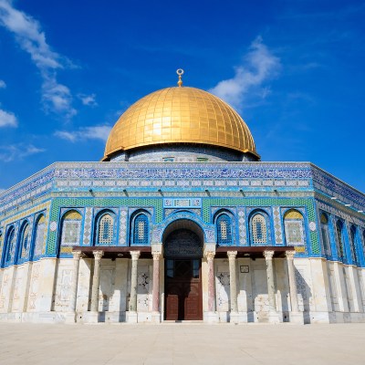 golden domed temple with blue and white tile