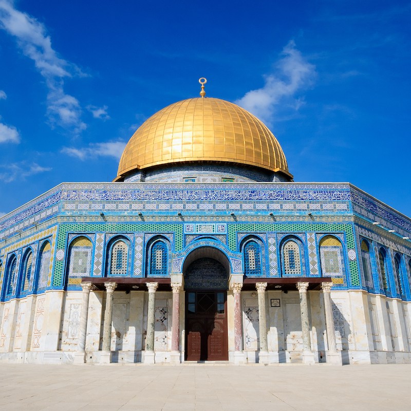 golden domed temple with blue and white tile