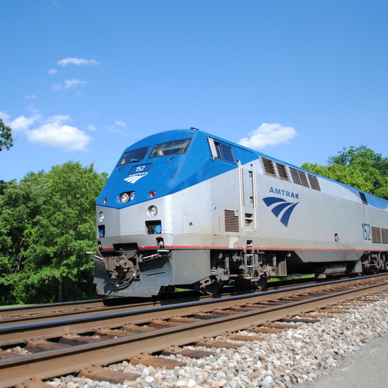 Amtrak PO29 speeding through a station