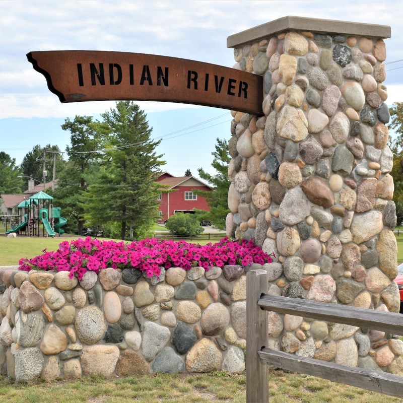 Sign that reads Indian River, Michigan.