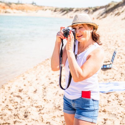 Marie taking photographs at Port Noarlunga, South Australia