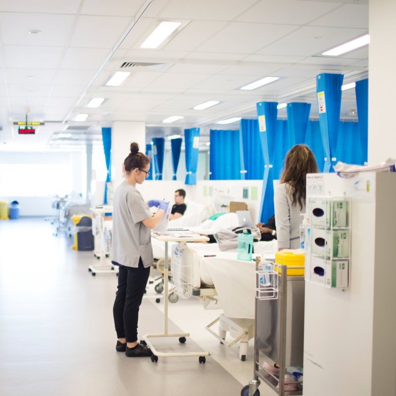 Nurses attending to patient notes during a clinical research trial at CMAX Clinical Research.