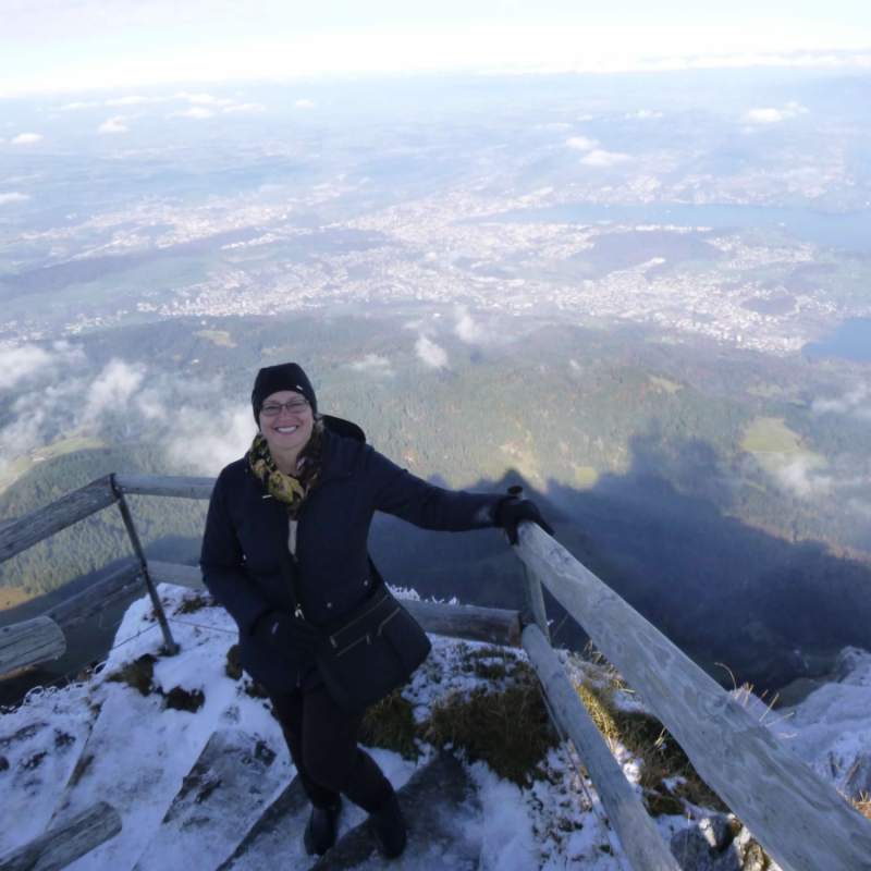 woman looking at camera with Switzerland in background