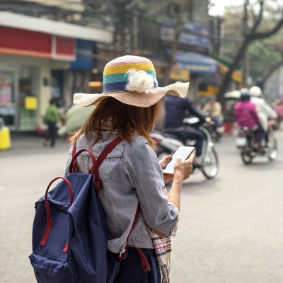 Woman using a smartphone in Hanoi